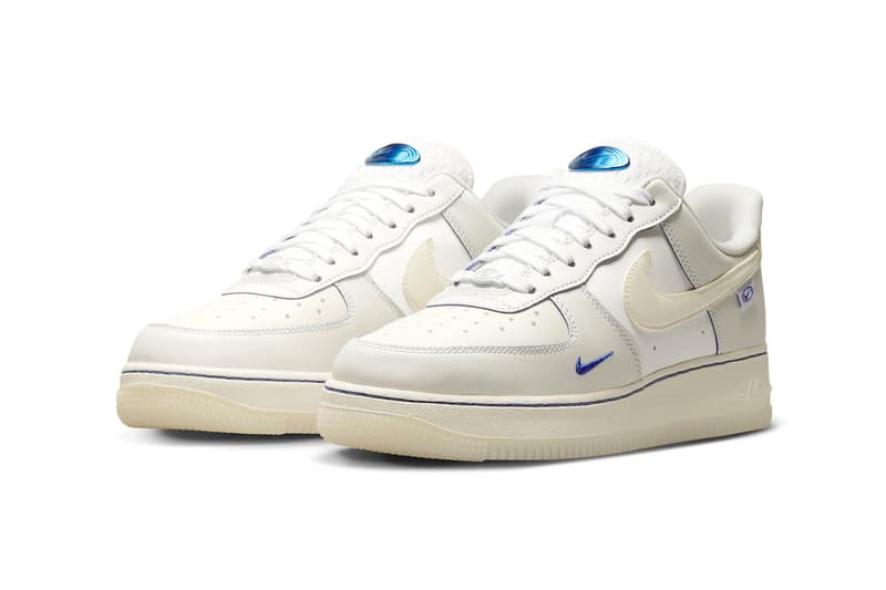 This Nike Air Force 1 Low Is Dressed in a Sail Colorway and Detailed With Blue Metallic sneakers low-top swoosh sneakers transluscent global motifs