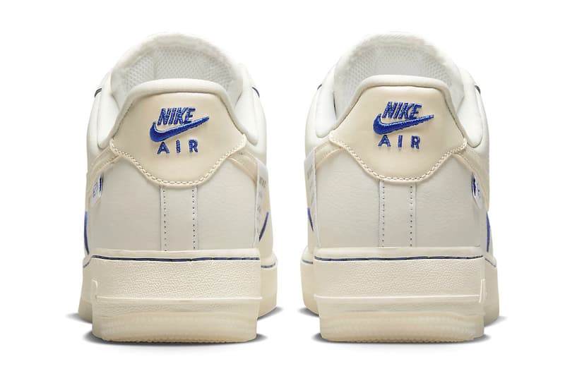 This Nike Air Force 1 Low Is Dressed in a Sail Colorway and Detailed With Blue Metallic sneakers low-top swoosh sneakers transluscent global motifs