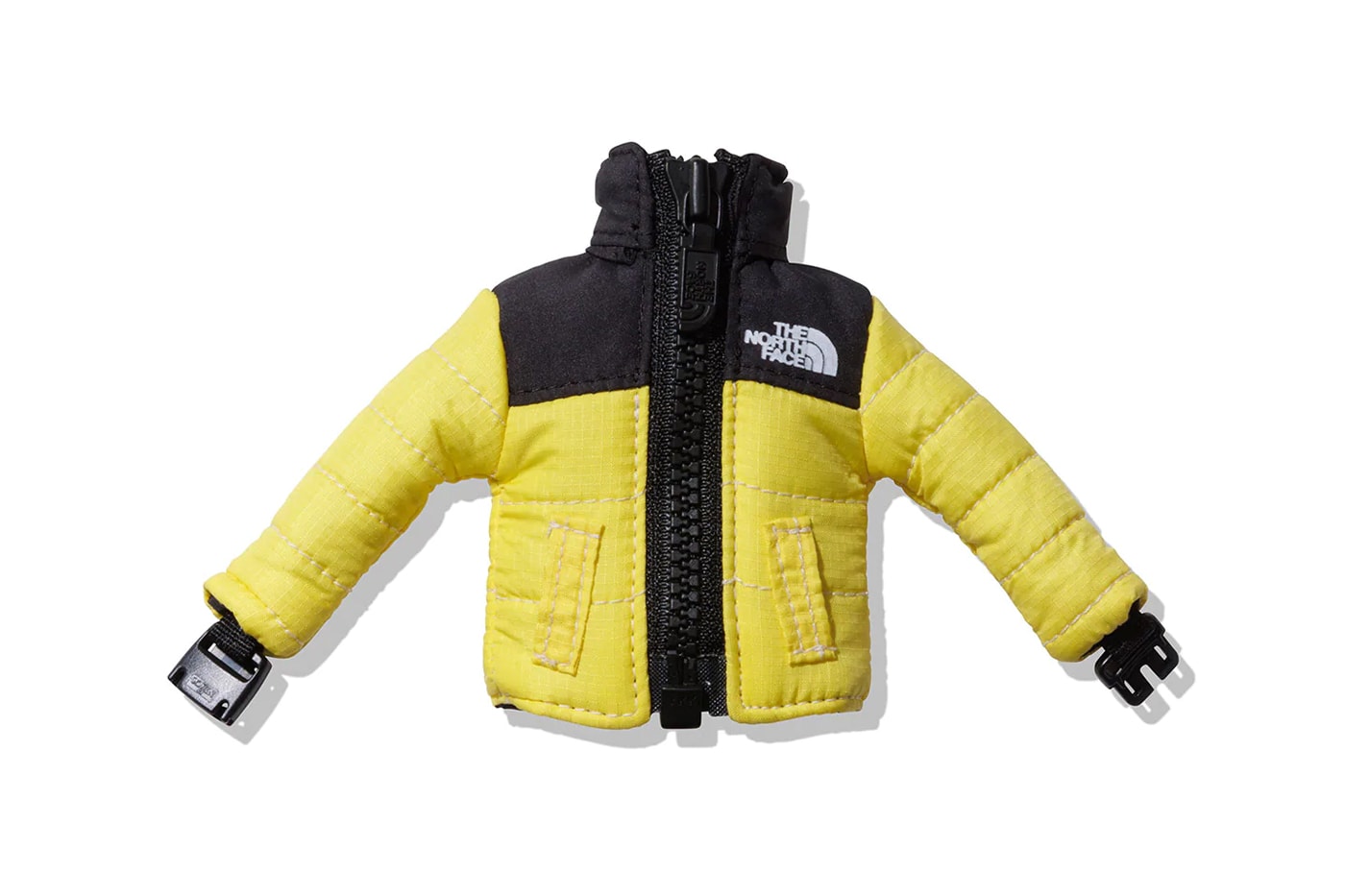 The North Face Face Introduces Mini Nuptse Jacket Keychains black yellow blue green gray sleeve buckle padded playful release info date price 