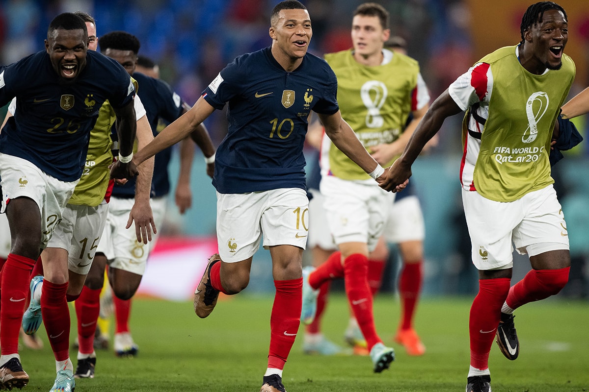 Kylian Mbappé Leads France to Seal a Spot in World Cup Knockout Stages denmark qatar 2-1 2022 fifa soccer football striker scored twice nike le coc psg paris saint germain
