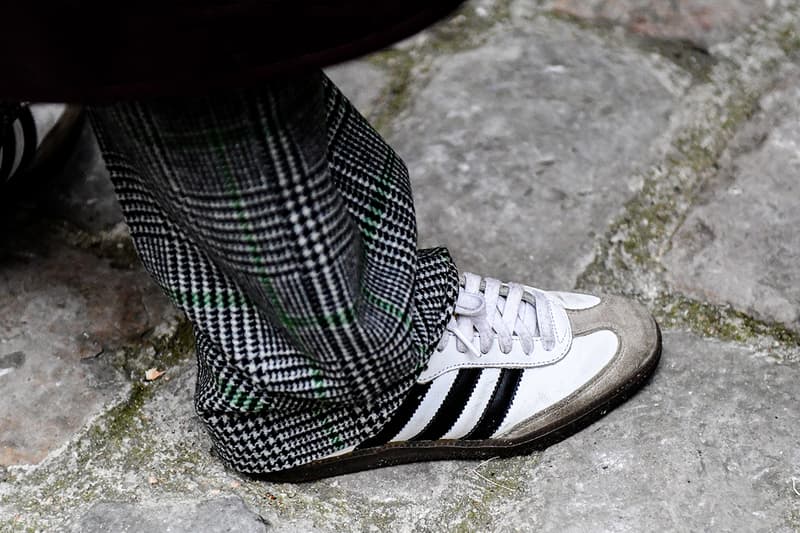 Biggest Street Style Footwear Trends at Men's Paris Fashion Week FW23 sacai nike adidas samba ebay travis scott jacquemus pleasures doc martin loafers nike sb dunk sacai vaporwaffle blazer salomon asics