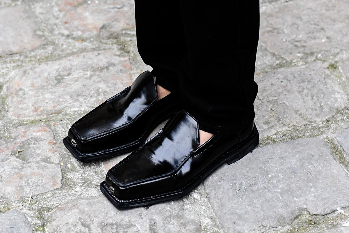 Biggest Street Style Footwear Trends at Men's Paris Fashion Week FW23 sacai nike adidas samba ebay travis scott jacquemus pleasures doc martin loafers nike sb dunk sacai vaporwaffle blazer salomon asics