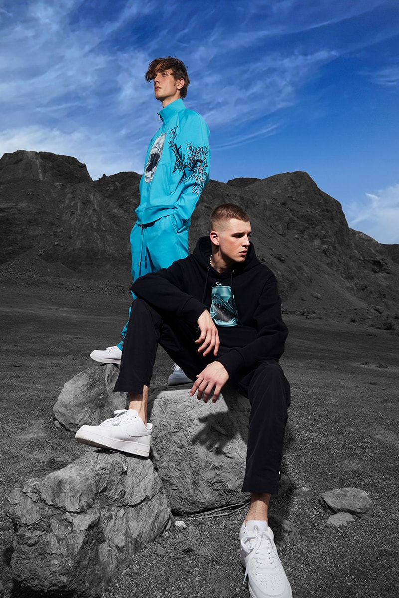 SHALAJ Releases Art Forward DISGUISE Collection jacket hoodie sweatpants shirts green black white blue