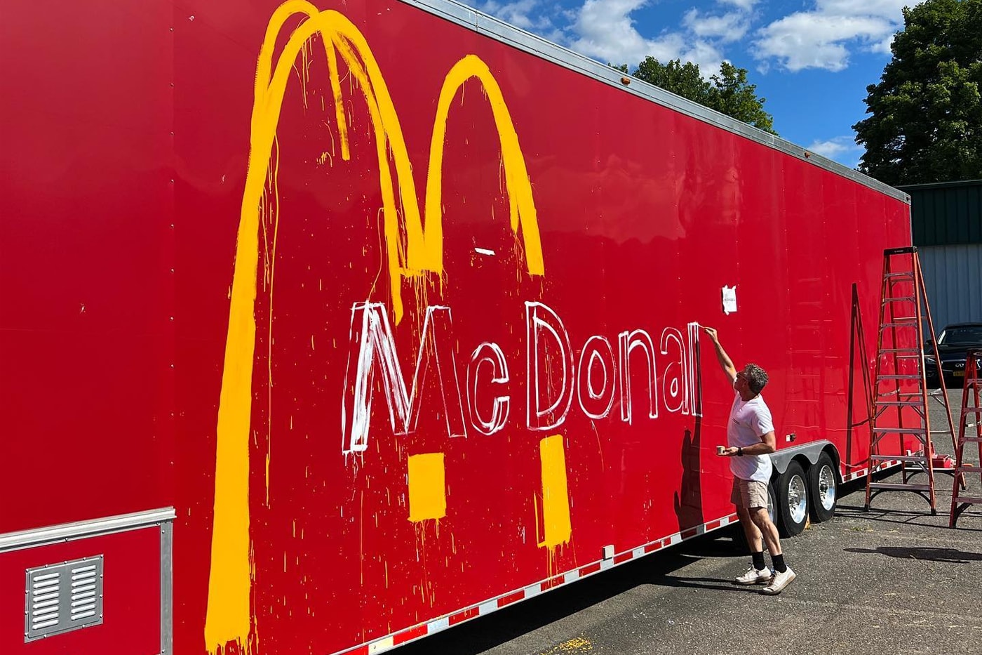 Tom Sachs Reveals New McDonald's Public Art trailer new milford max power motors happy meal graffiti spray paint