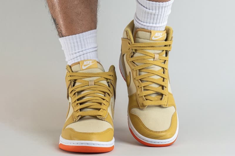 On-Feet Look at Nike Dunk High "Gold Canvas" DV7215-700 release info team gold wheat gold safety orange white high top basketball