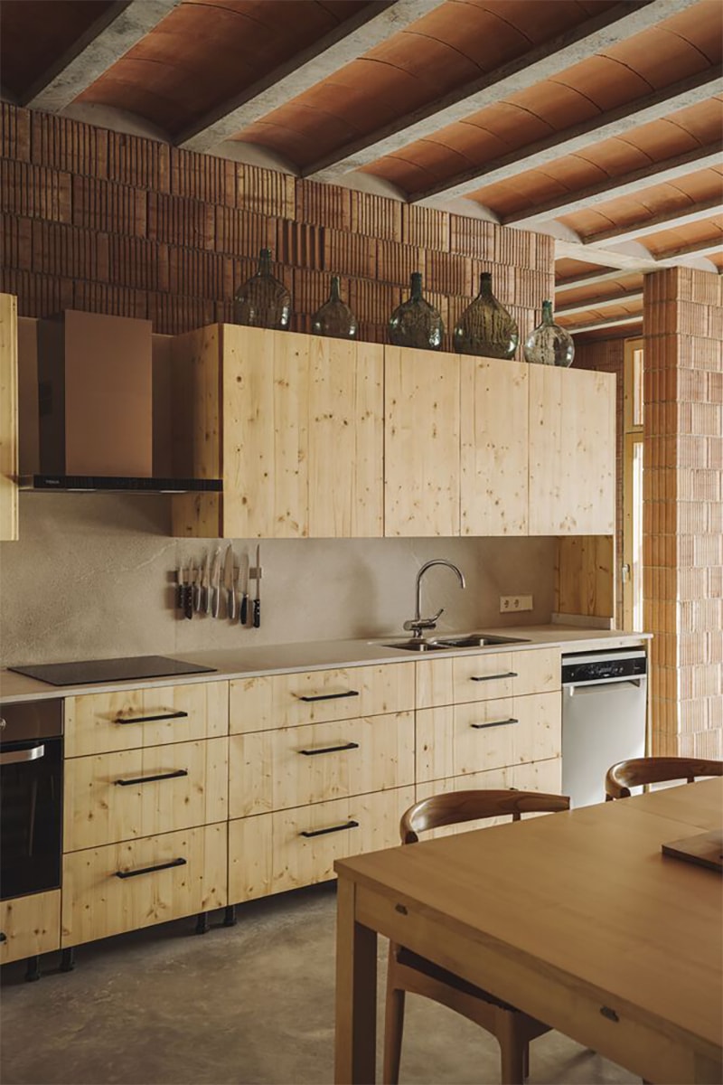 "Battery House" in Mallorca Combines Terracotta Tones and Wooden Details