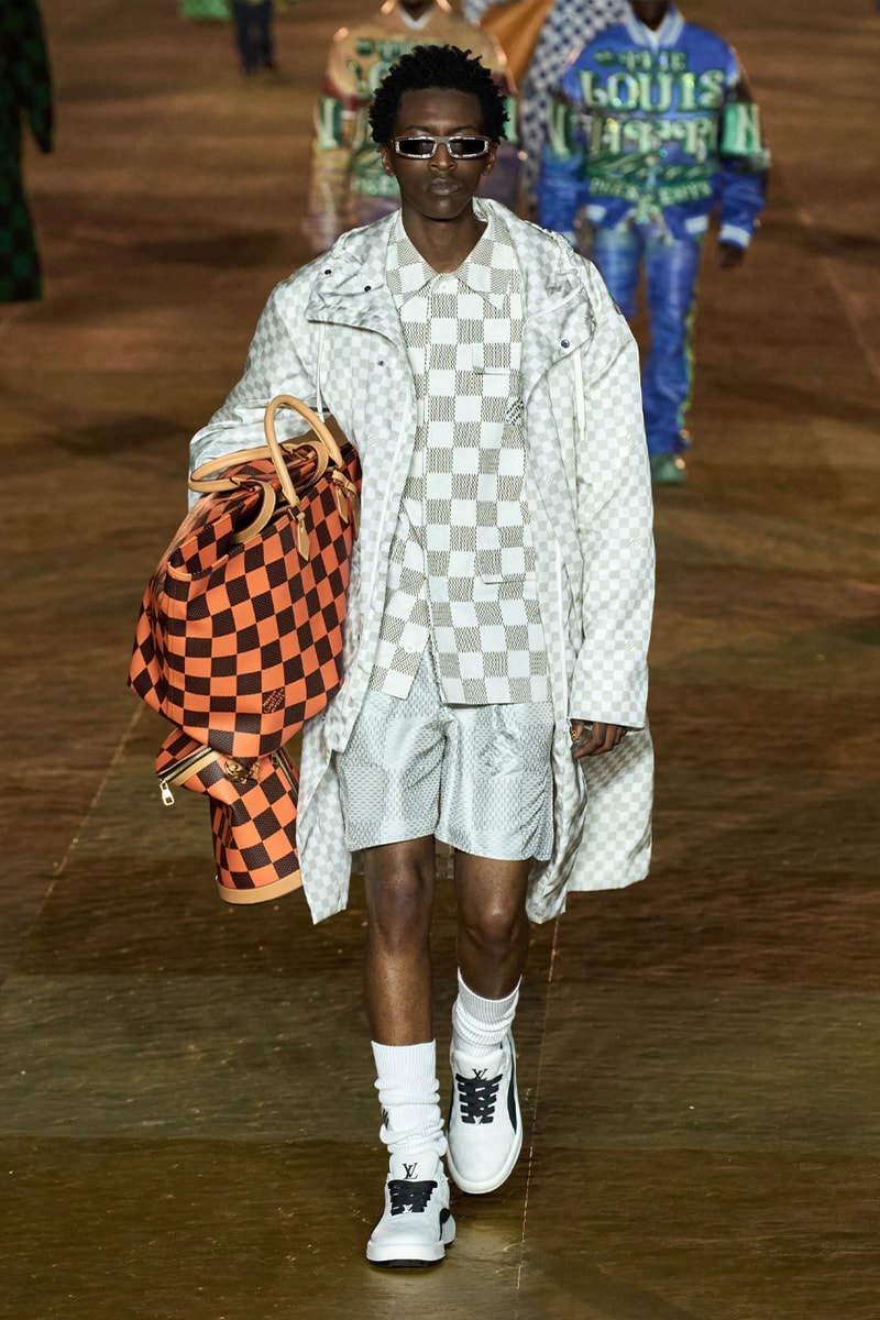 Pharrell's SS24 Louis Vuitton Debut Was Nothing Short of a Spectacle Paris fashion week pont neuf jay z beyonce rihanna asap rocky asap ferg pusha t verdy pharrell williams maluma jbalvin lewis hamilton fenty