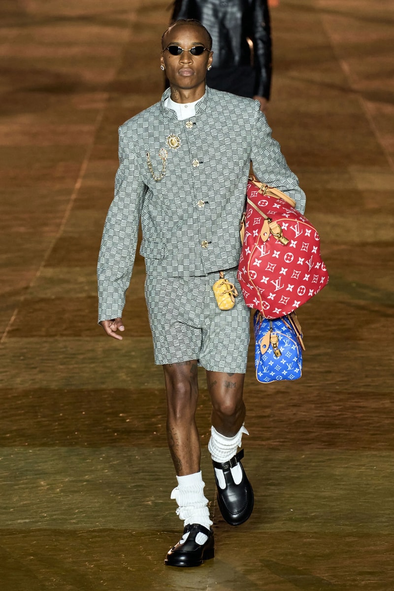 Pharrell's SS24 Louis Vuitton Debut Was Nothing Short of a Spectacle Paris fashion week pont neuf jay z beyonce rihanna asap rocky asap ferg pusha t verdy pharrell williams maluma jbalvin lewis hamilton fenty