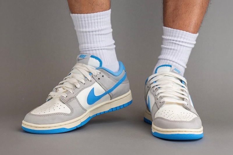 On-Feet Look at the Nike Dunk Low "Athletic Department" FN7488-133 Sail/University Blue-Light Iron Ore-Light Smoke Grey-Coconut Milk sneakers swoosh low top university blue