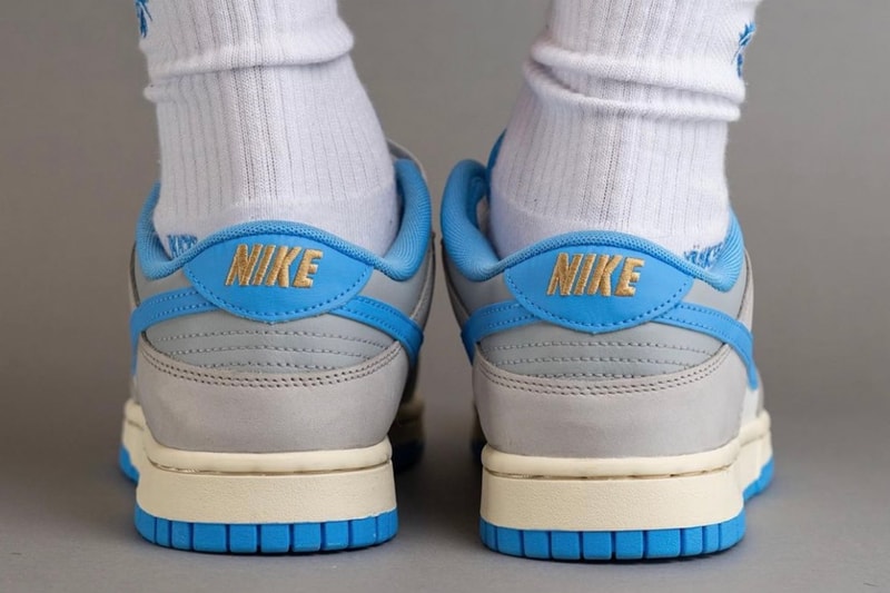 On-Feet Look at the Nike Dunk Low "Athletic Department" FN7488-133 Sail/University Blue-Light Iron Ore-Light Smoke Grey-Coconut Milk sneakers swoosh low top university blue