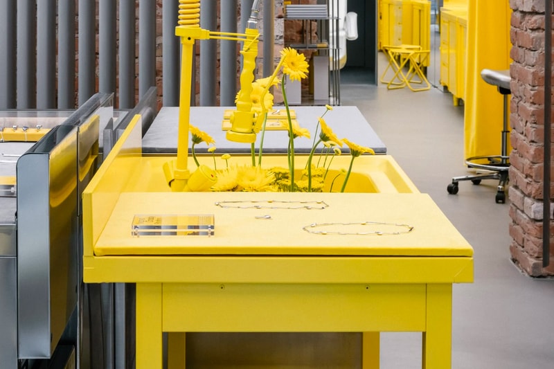 Crosby Studios Avgvst Berlin Store Interior Design jewelry yellow kitchen steel stainless brick chair table necklace bracelet ring gold ghost kitchen