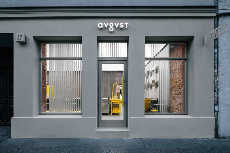 Crosby Studios Avgvst Berlin Store Interior Design jewelry yellow kitchen steel stainless brick chair table necklace bracelet ring gold ghost kitchen