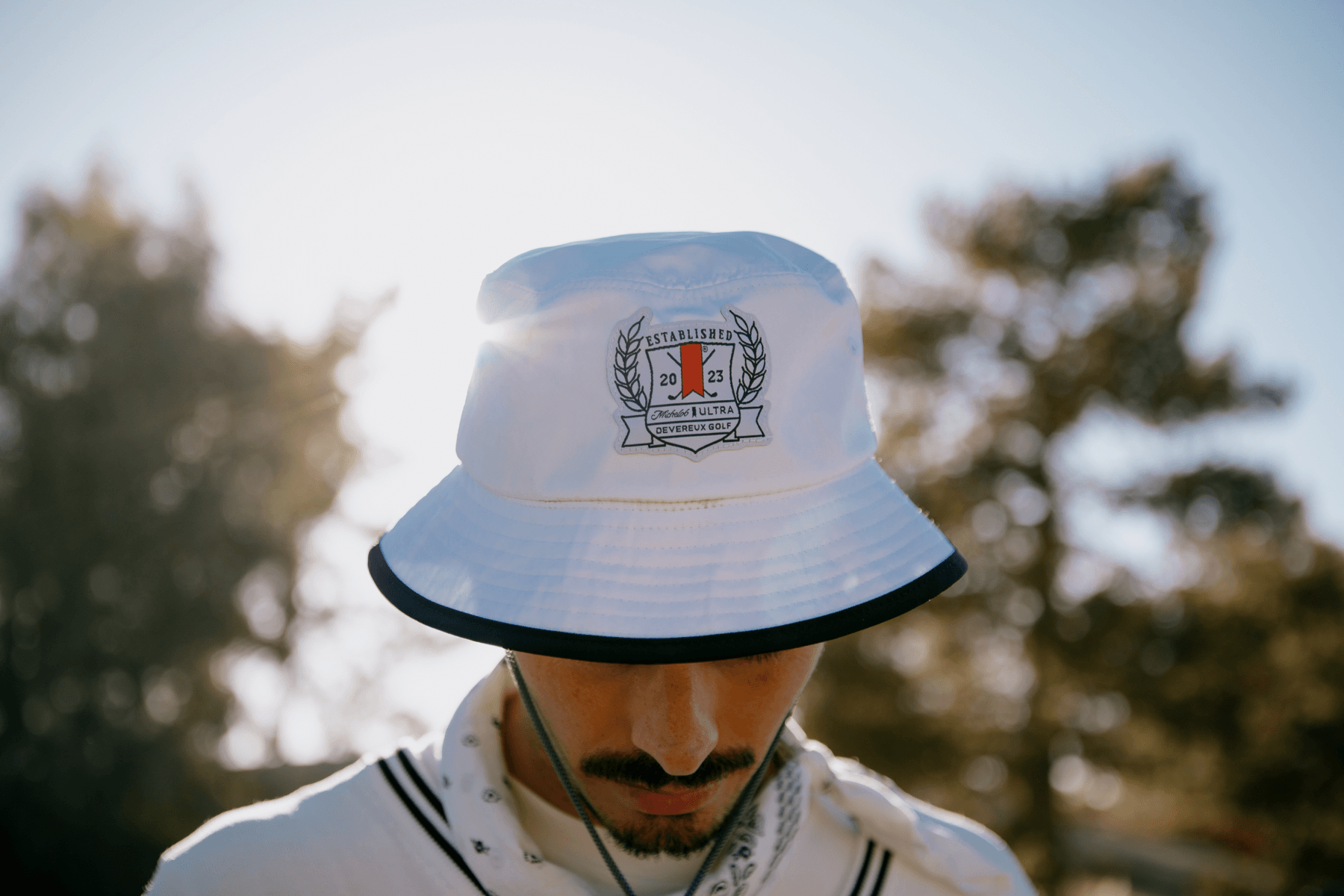 Michelob ULTRA Devereux Will Bert Brunner Golf Apparel Capsule Raven Golf Club Video Interview Polos Cardigans Bucket Hats Shorts