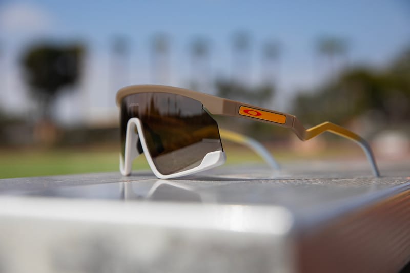 A Chinese woman and her son look at an Oakley sunglasses advertisement  featuring American Olympic athletes wrapped in the Stars and Stripes in  Beijing on July 23, 2016. Oakley, a California-based sporting