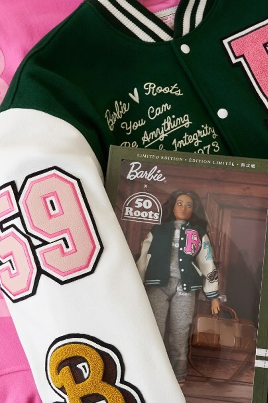 Roots Celebrates 50 Years With Barbie Collaboration varsity jacket icon barbie doll limited edition exclusive barbie decals canadian lifestyle brand canada