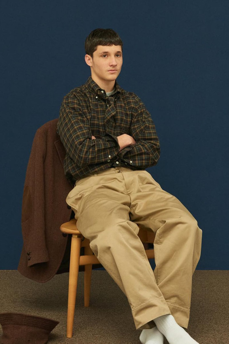 Shinsuke Nakada Debuts "UNLIKELY" New Brand With FW23 Collection carhartt beams japan creative director workwear elevated streetwear hoodie tweed wool parka jacket silhouette fall winter vest outerwear hat tie bucket crewneck shirt pants jeans denim
