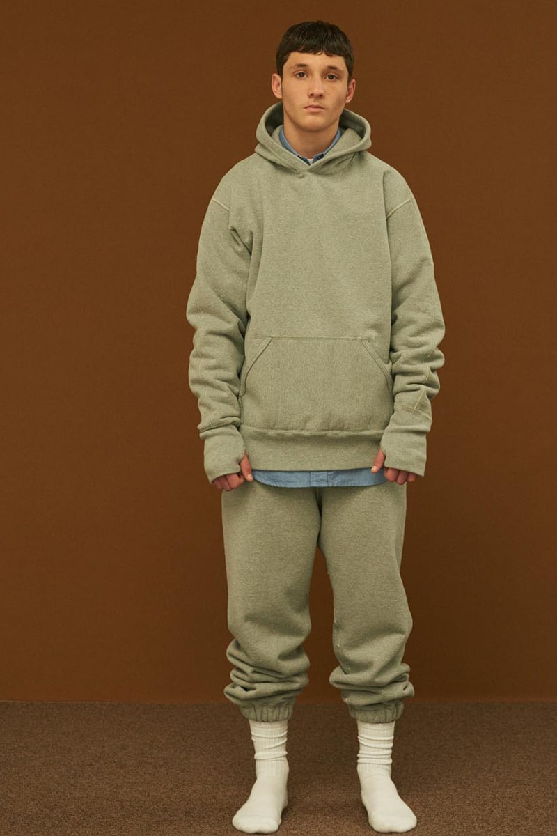 Shinsuke Nakada Debuts "UNLIKELY" New Brand With FW23 Collection carhartt beams japan creative director workwear elevated streetwear hoodie tweed wool parka jacket silhouette fall winter vest outerwear hat tie bucket crewneck shirt pants jeans denim