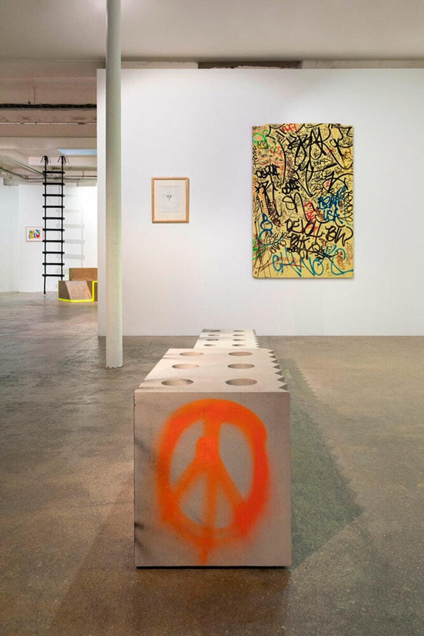 virgil abloh brings an urban language to galerie kreo with graffiti-sprayed,  concrete furniture