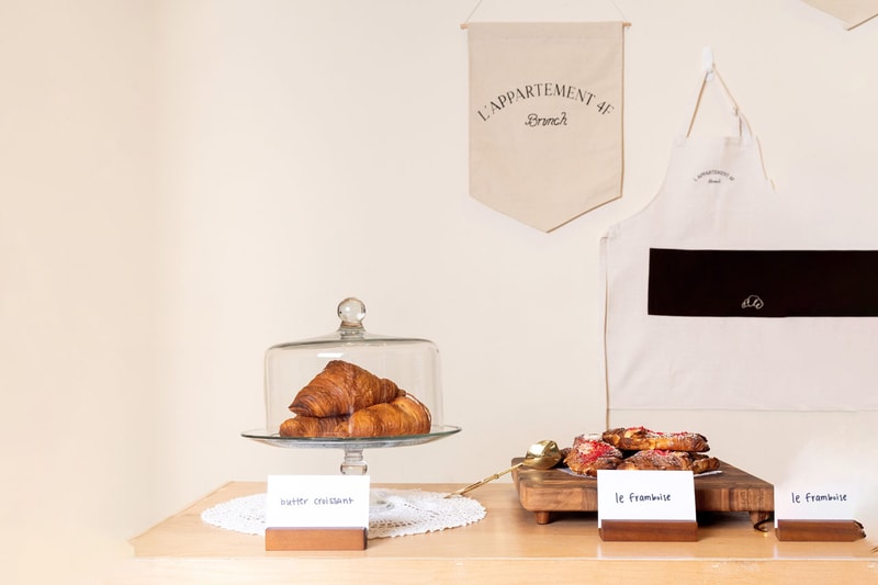 NYC Label Brunch Taps Brooklyn's L'Appartement 4F Bakery for a Tasteful Collab madhappy lifestyle hotel slipper footwear drop new york city croissant breakfast cereal 