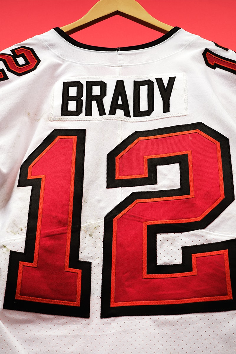 Tom Brady's Final Game-Worn Jersey Is Auctioning for $1.5 Million USD nfl sotheby's auction tampa bay buccaneers american football quarterback goat nfc dallas cowboys
