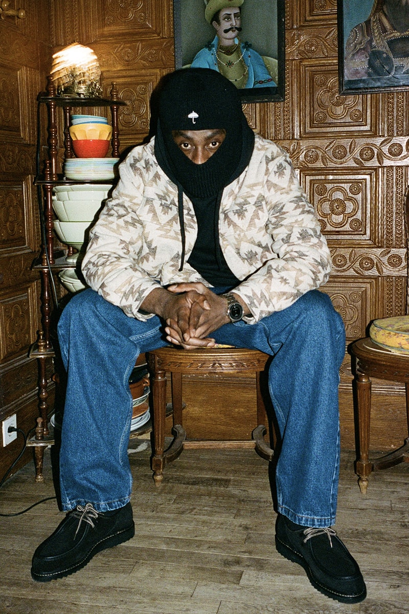 Hélas Takes You on a Holiday Cabin Getaway for Winter 2023 lookbook release info post-athleisure cabin vibes old world chateau surrounding forests balaclava earthy tones 