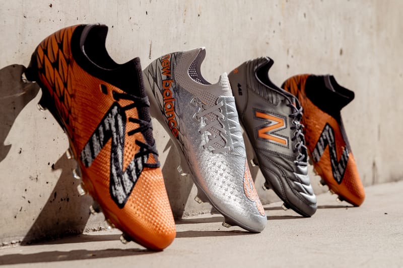 orange new balance football boots
