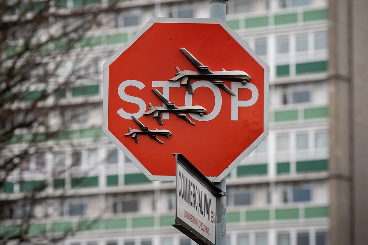 New Banksy Stop Sign Art Stolen Less Than an Hour After Unveiling peckham selfish south london southampton way commercial way military drones gaza palestine israel