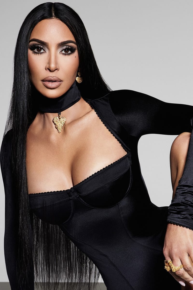 Kim Kardashian Poses in Late Night Intimates for New Stretch Satin SKIMS Campaign Veneda Carter gold bold heart pendant lustruous kim k shape wear onyx