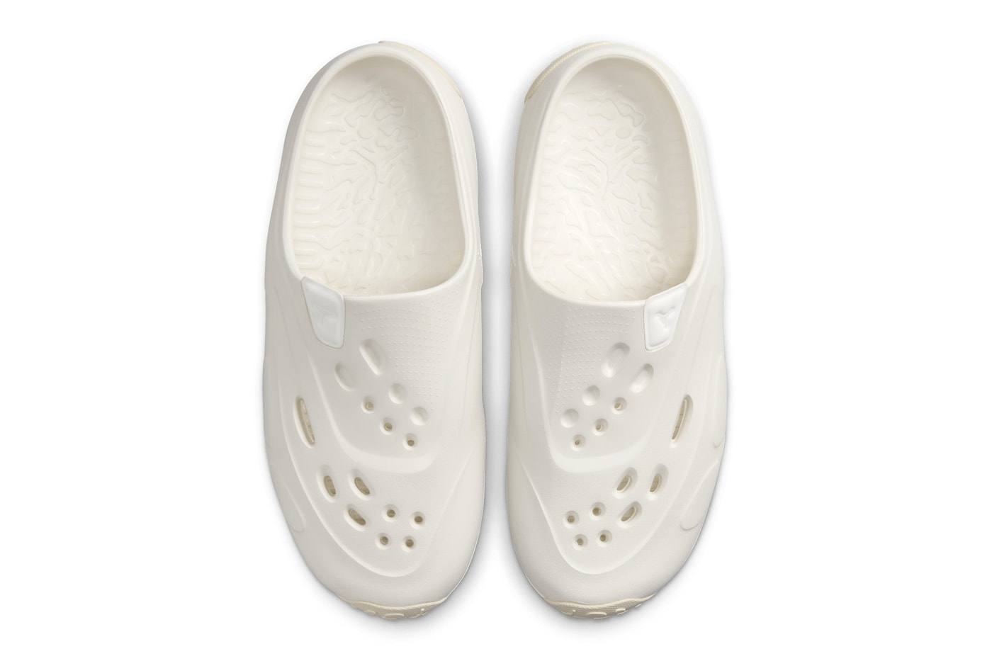 Jordan Brand Introduces New Slip-Ons, the Jordan Roam sail coconut milk summer 2024 sandals mules plastic rubber
