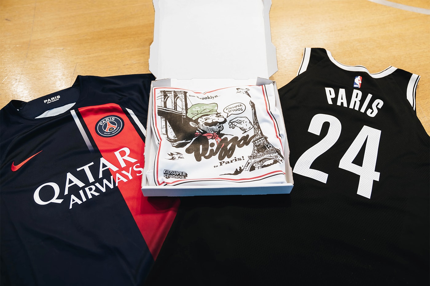 Brooklyn Nets Celebrates Paris NBA Game With Kidsuper and Paris Saint-Germain Merch Collaboration nba paris game 2024 cleveland cavaliers paris pizza parlor eiffel tower colm dillane