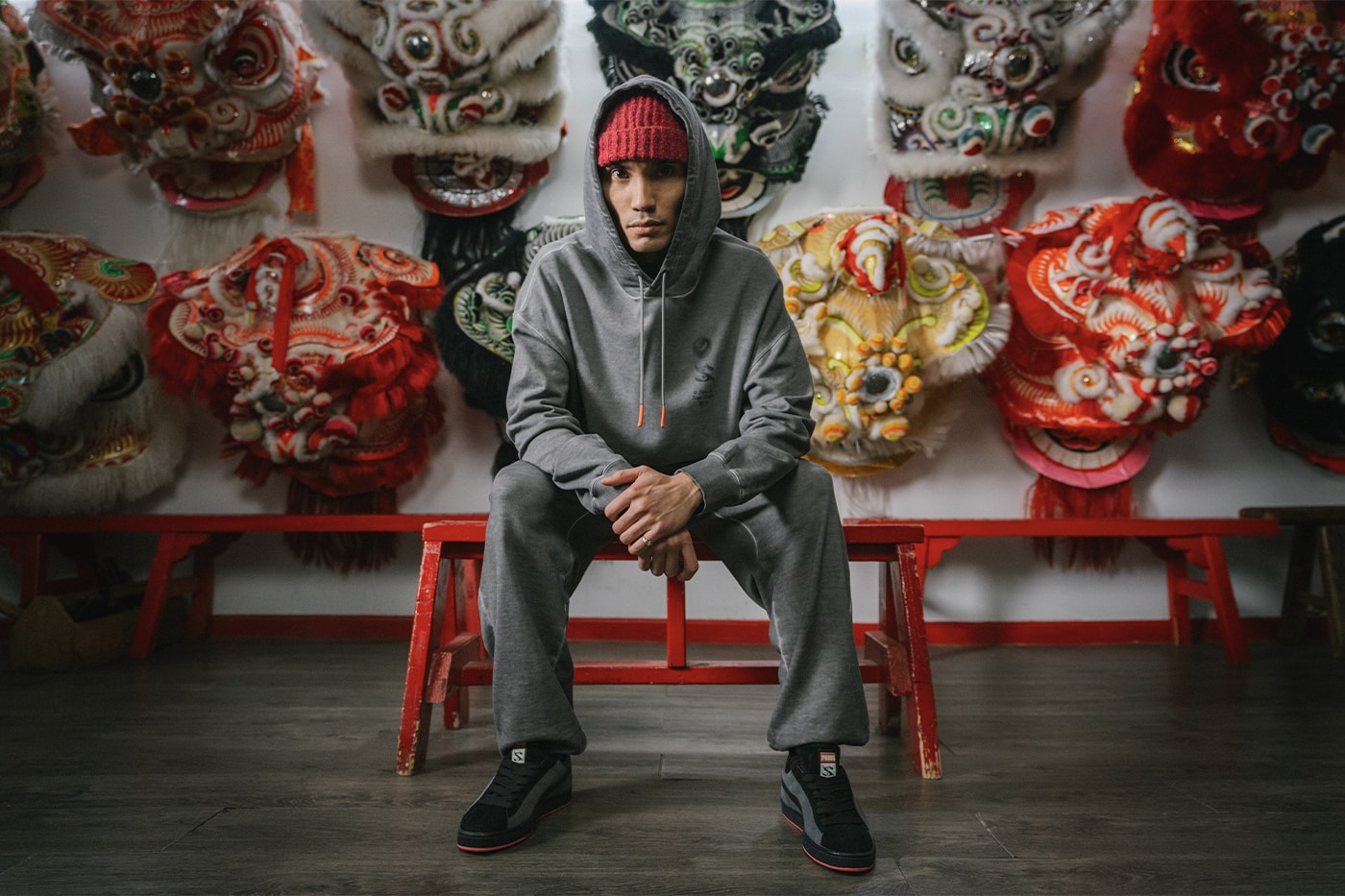 STAPLE and PUMA Join Forces for a Celebratory "Year of the Dragon" Collection collaboration lunar new year lion dance club new york city chinese fremasons athletic club cfmac sneakers granola alpine snow puma black suede sweatpants hoodie tshirt