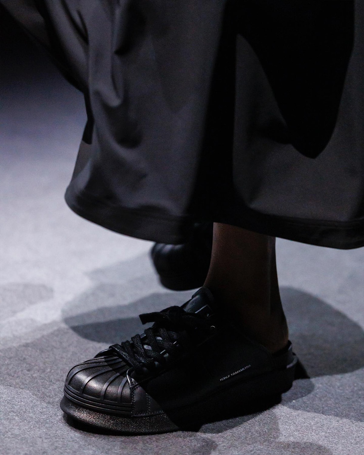 Biggest Footwear Moments From Paris Fashion Week SS25 comme des garcons homme plus nike air force 1 low black air force 1 low junya watanabe oakley factory team nigo air force 3 low feng chen wang ugg tasman sacai nike zegamadome a$ap rocky awge puma story mfg. asics roa suicoke cecilie bahnsen asics gel-quantum 360 viii y3 yohji yamamoto adidas rombaut puma levitation sock