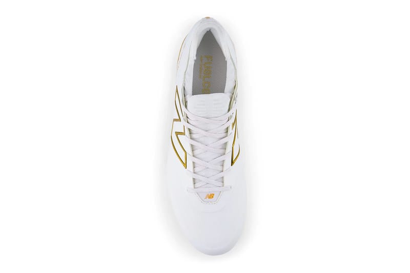 white and gold new balance baseball cleats