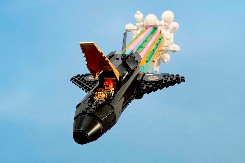 pharrell williams lego set spaceship black gold over the moon 966 pieces piece by piece animated movie preview collaboration