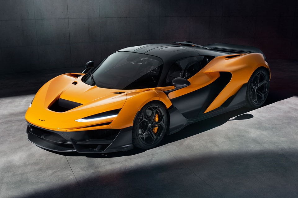 The McLaren W1 and luxury hypercars parked near the clubhouse at Royal Birkdale during The Open.
