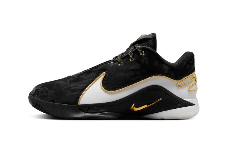 nike black gold and white shoes
