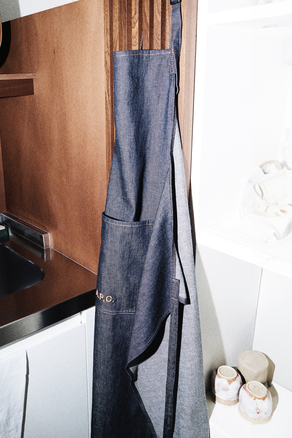 A.P.C. Drops Cooking Essentials in Olive Oil and Apron Combo france season 3 kitchen mathias m/m graphic studio