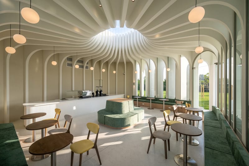 Curvy Dining: An Architectural Bloom in Bangkok's Industrial Landscape