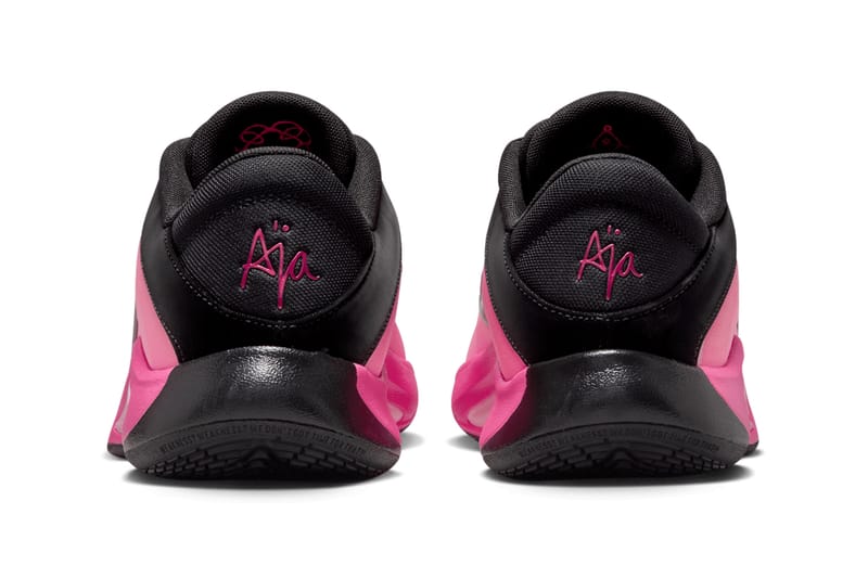 black nike shoes with pink laces