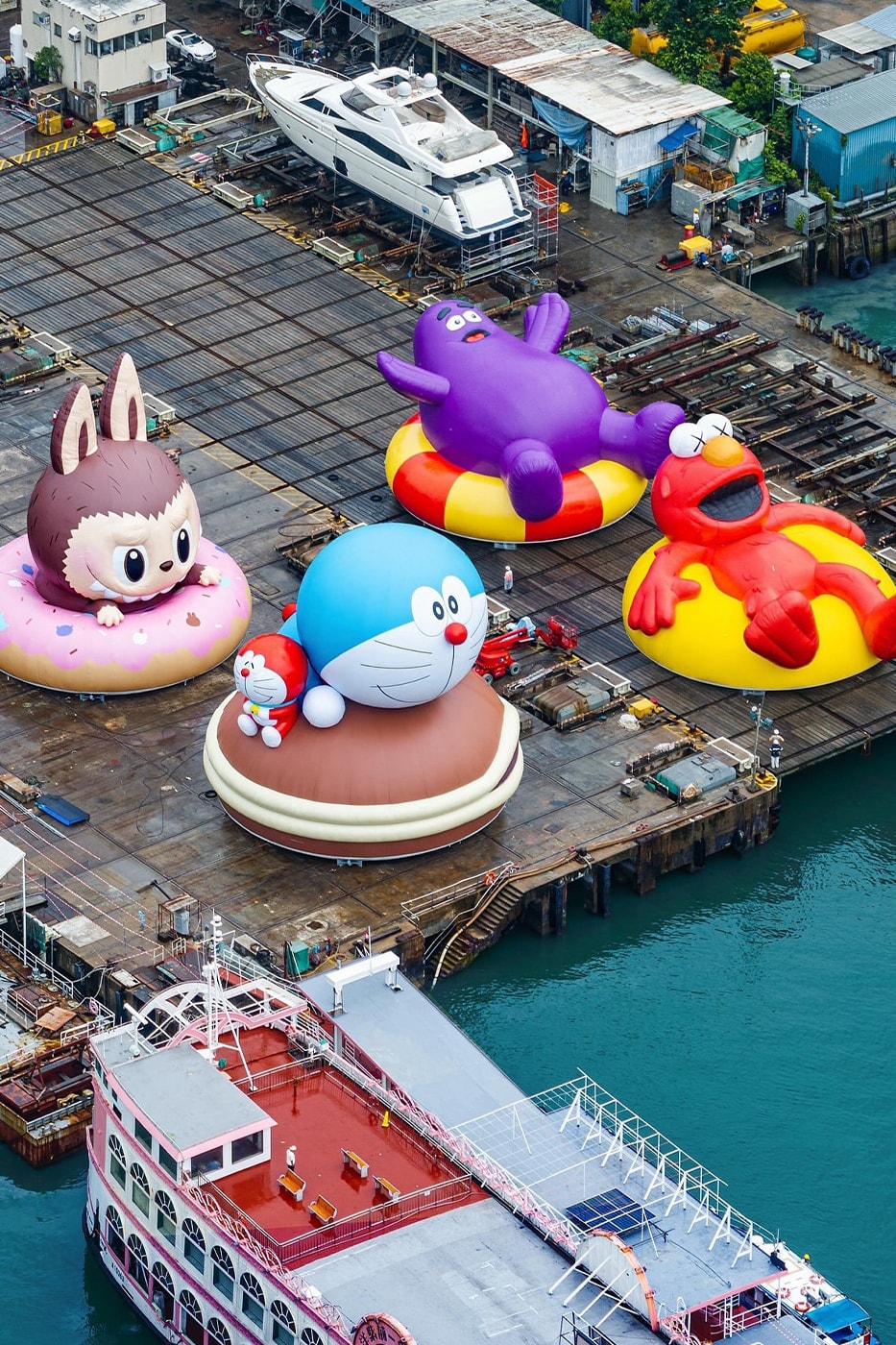 KAWS Joins Forces With AllRightsResereved for World's First and Largest Water Parade labubu mcdonalds grimace sesame street doraemon netflix snoopy