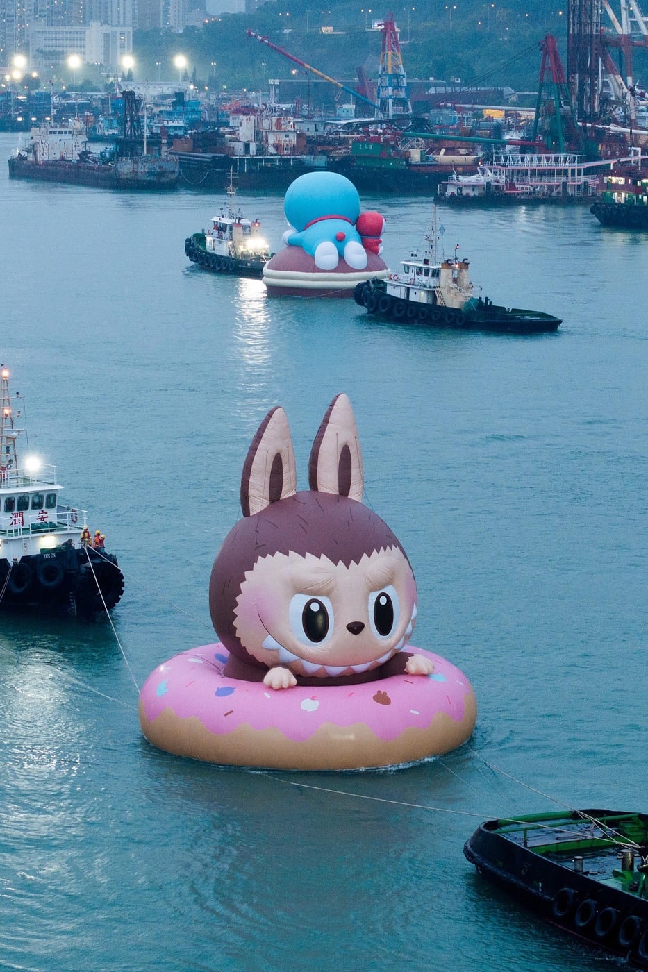 KAWS Joins Forces With AllRightsResereved for World's First and Largest Water Parade labubu mcdonalds grimace sesame street doraemon netflix snoopy