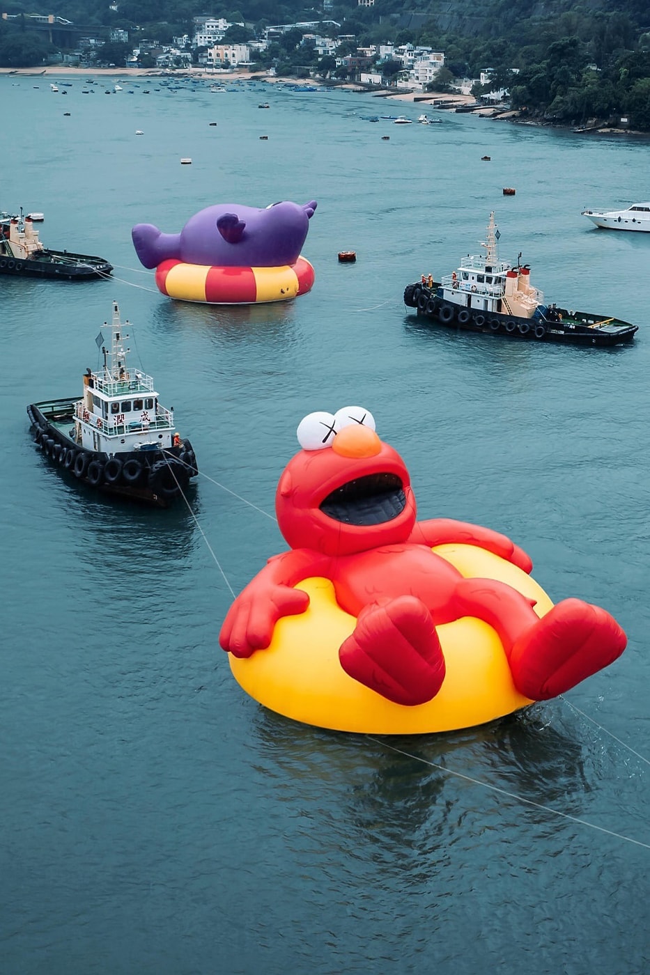 KAWS Joins Forces With AllRightsResereved for World's First and Largest Water Parade labubu mcdonalds grimace sesame street doraemon netflix snoopy