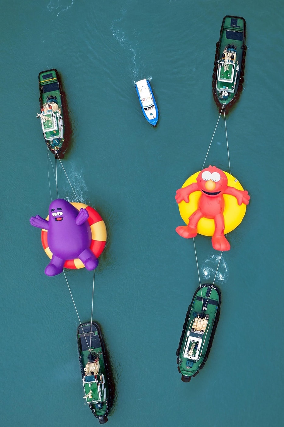 KAWS Joins Forces With AllRightsResereved for World's First and Largest Water Parade labubu mcdonalds grimace sesame street doraemon netflix snoopy