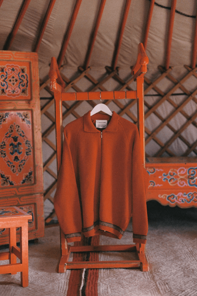 Mongolian steppe A Kind Of Guise's FW25 collection, Altai Mirage, Artist Jonathan Niclaus, Italian cotton corduroy, lambswool and hairy wool blends, purple dragon emblem,Dragon Wool Jacket and the Khivs Pullover.