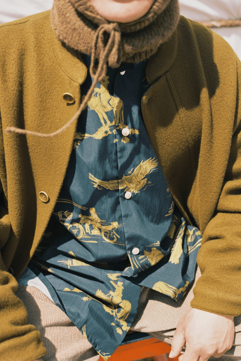 Mongolian steppe A Kind Of Guise's FW25 collection, Altai Mirage, Artist Jonathan Niclaus, Italian cotton corduroy, lambswool and hairy wool blends, purple dragon emblem,Dragon Wool Jacket and the Khivs Pullover.