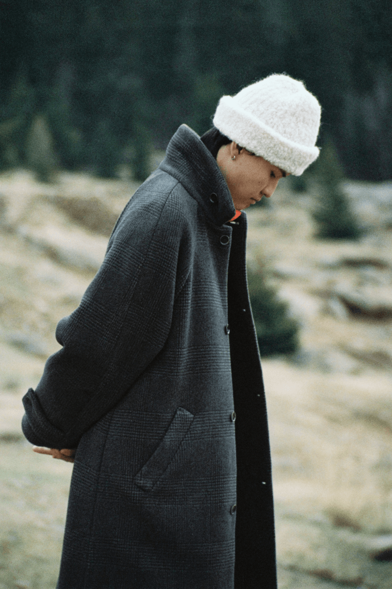 Mongolian steppe A Kind Of Guise's FW25 collection, Altai Mirage, Artist Jonathan Niclaus, Italian cotton corduroy, lambswool and hairy wool blends, purple dragon emblem,Dragon Wool Jacket and the Khivs Pullover.