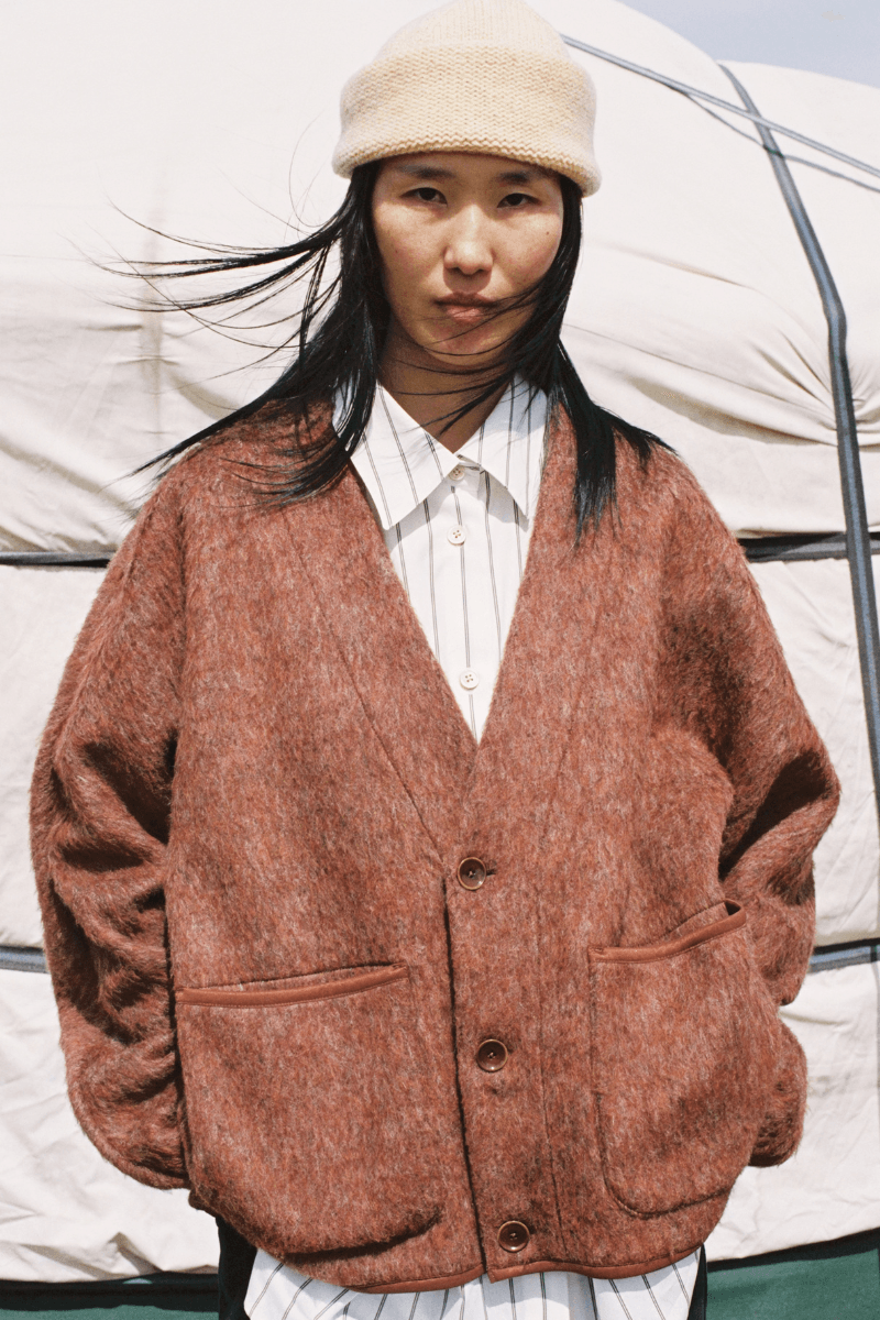 Mongolian steppe A Kind Of Guise's FW25 collection, Altai Mirage, Artist Jonathan Niclaus, Italian cotton corduroy, lambswool and hairy wool blends, purple dragon emblem,Dragon Wool Jacket and the Khivs Pullover.