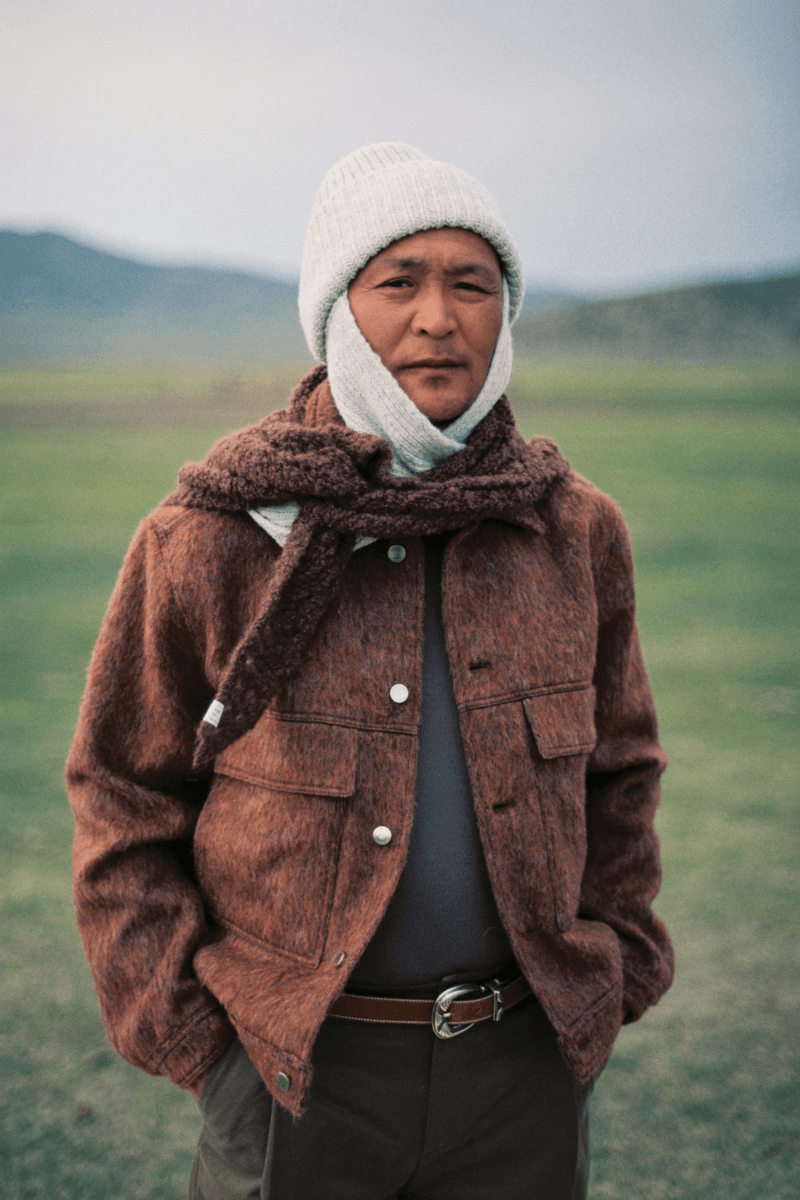 Mongolian steppe A Kind Of Guise's FW25 collection, Altai Mirage, Artist Jonathan Niclaus, Italian cotton corduroy, lambswool and hairy wool blends, purple dragon emblem,Dragon Wool Jacket and the Khivs Pullover.