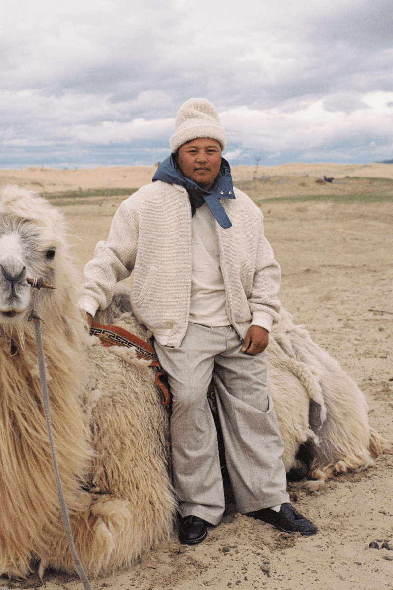 Mongolian steppe A Kind Of Guise's FW25 collection, Altai Mirage, Artist Jonathan Niclaus, Italian cotton corduroy, lambswool and hairy wool blends, purple dragon emblem,Dragon Wool Jacket and the Khivs Pullover.