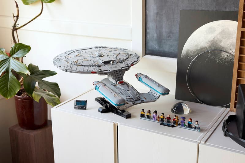 LEGO Icons Star Trek: U.S.S. Enterprise NCC-1701-D with nine TNG minifigures arranged on an angled display stand